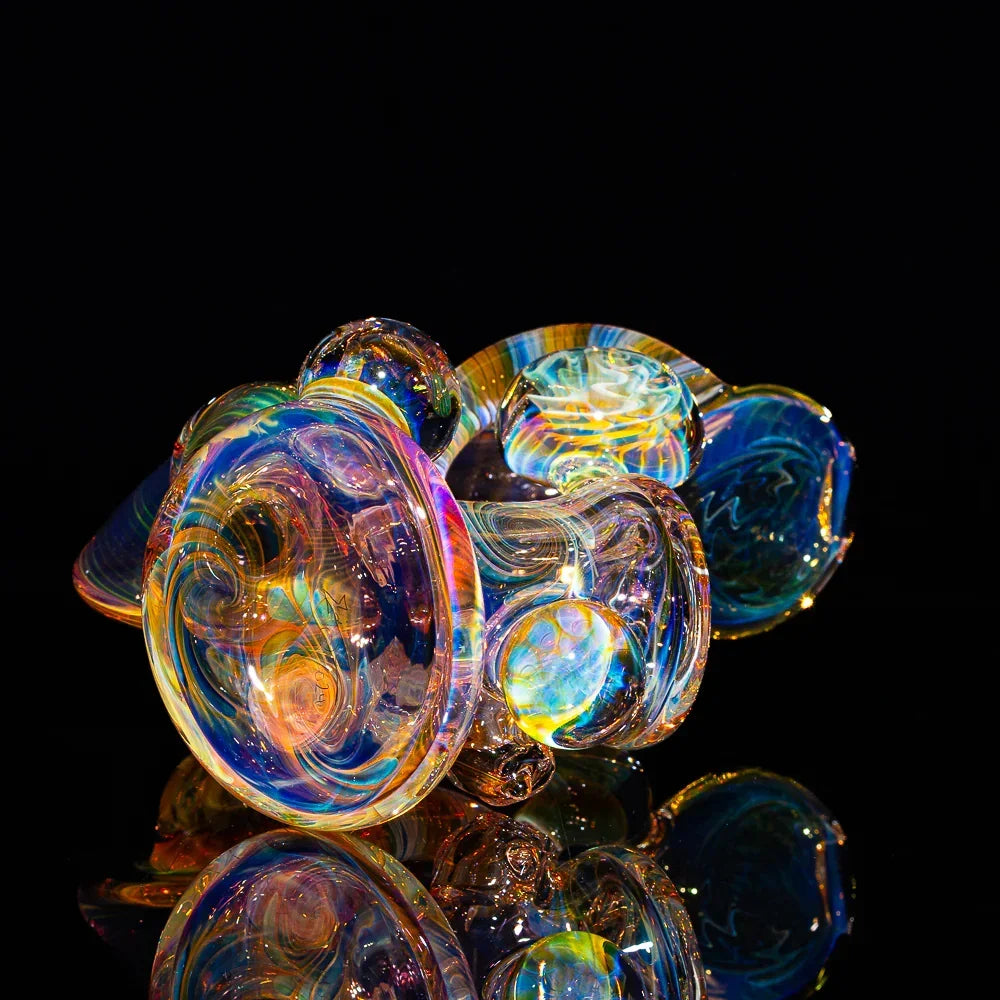 Heady fumed glass pipe with colorful swirls and reflective surface on black background