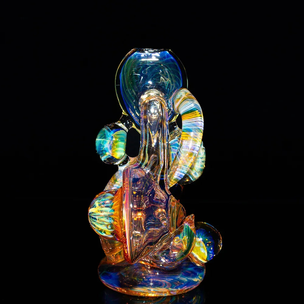 Heady fumed glass art pipe with colorful swirls and abstract shapes against black background