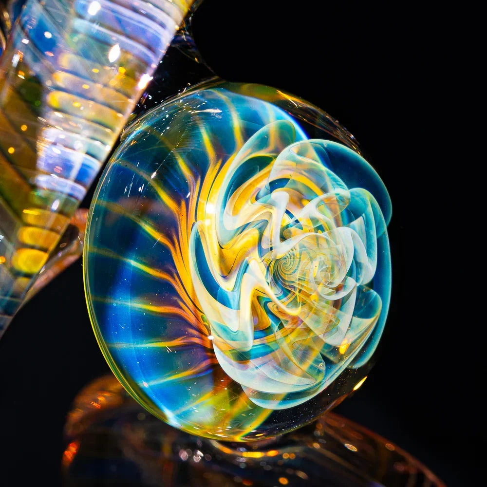 Colorful heady glass art piece with intricate spiral fume design and vibrant accents