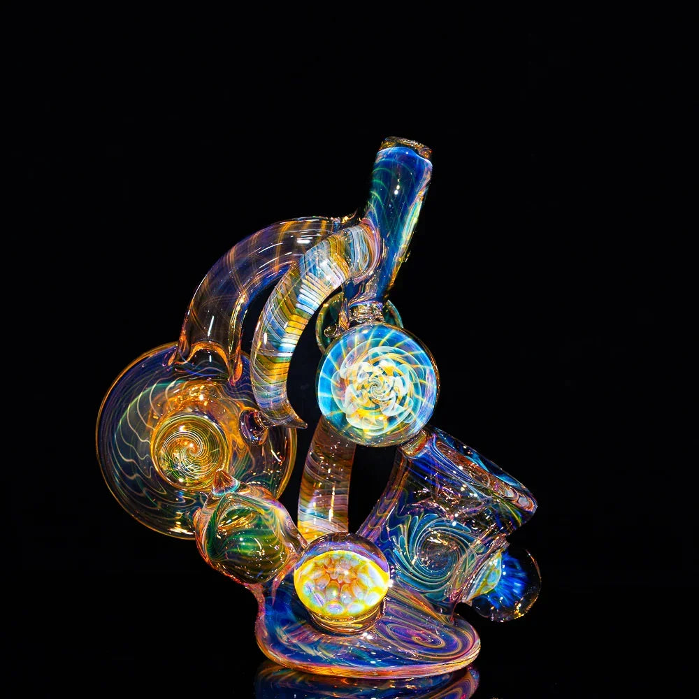 Heady glass art pipe with colorful fume swirls and intricate patterns on a black background