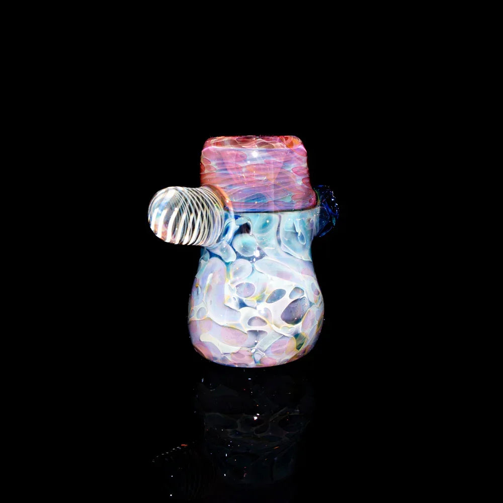 Colorful hand-blown glass hammer pipe with marbled patterns on a black background