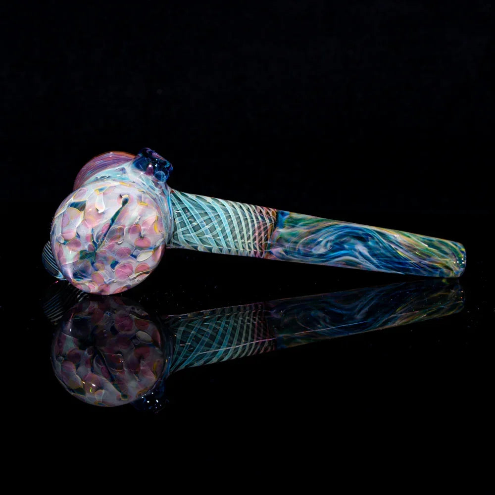 Colorful glass hammer pipe with intricate swirled patterns on a black background
