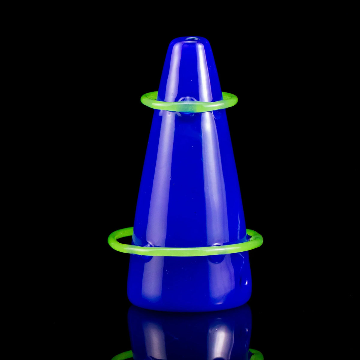 Blue volcano-shaped glass pipe with neon green rings on black background
