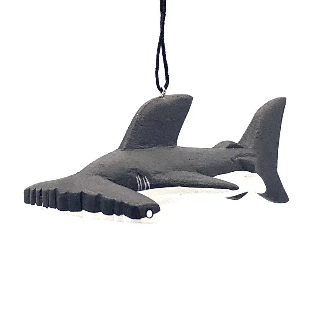 Hammerhead shark ornament with black and white detail, hanging on a string