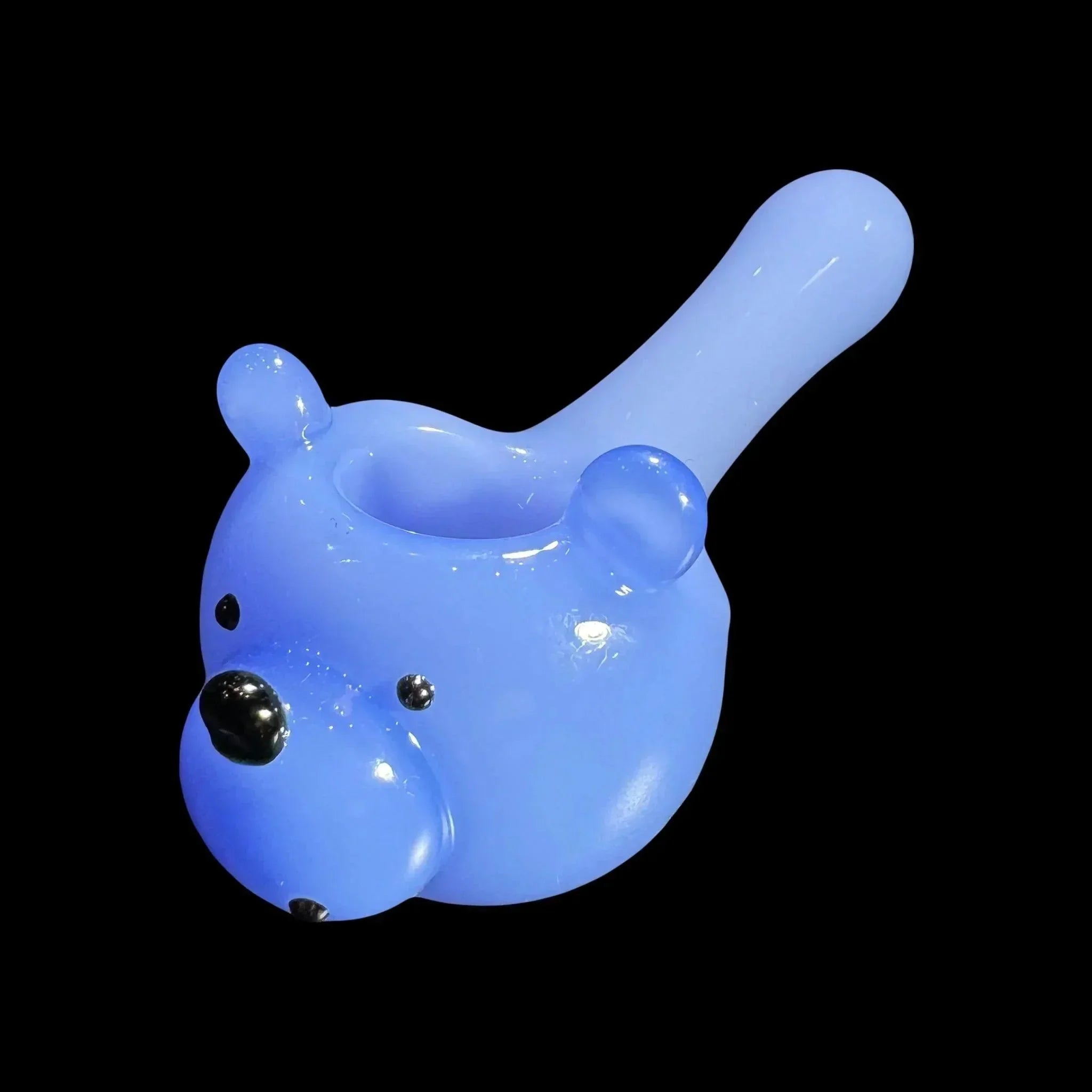 Blue glass bear-shaped hand pipe for smoking, isolated on black background