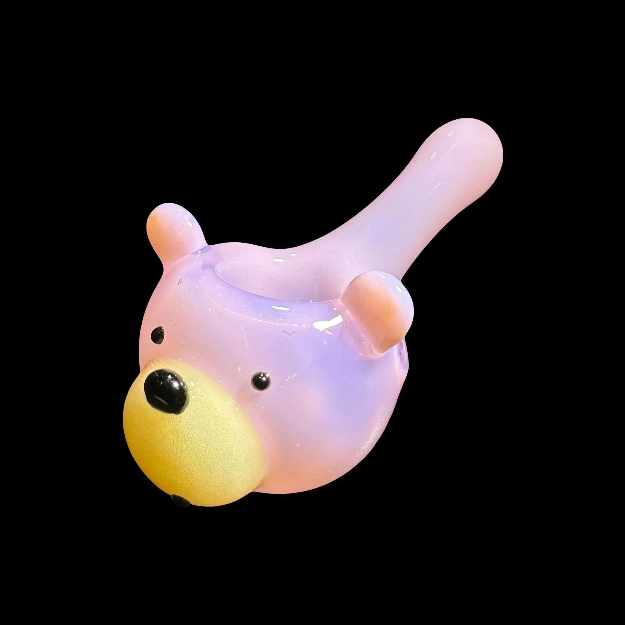 Cute glass bear hand pipe in pastel colors on black background, novelty smoking accessory