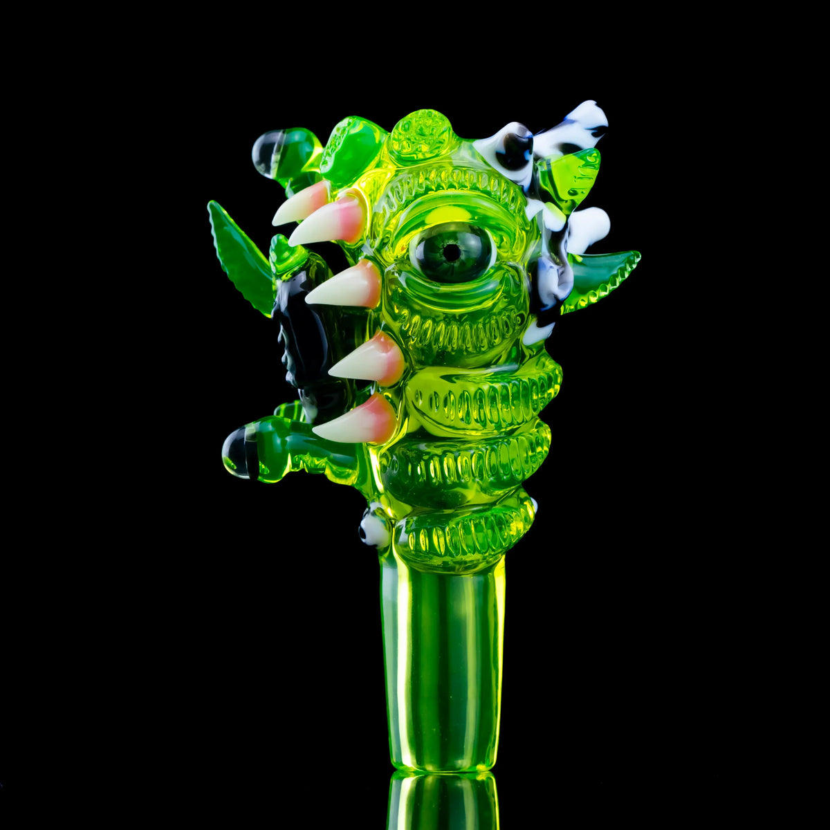 Green monster-themed glass bowl slide with three holes and white teeth, heady glass art