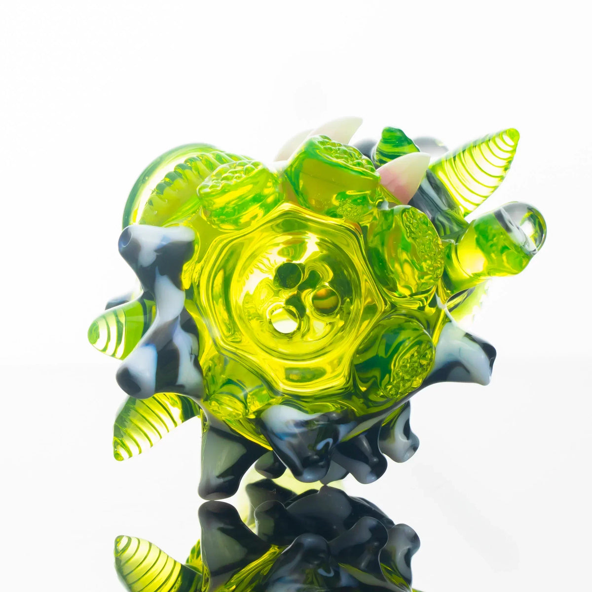 Abstract yellow and green glass slide bowl with three-hole design and sculpted details