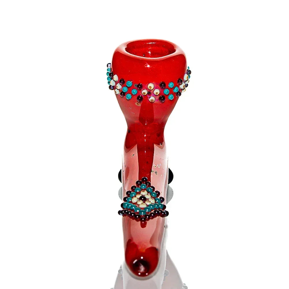 Red glass hand pipe with colorful raised bead accents on bowl and stem, isolated on white