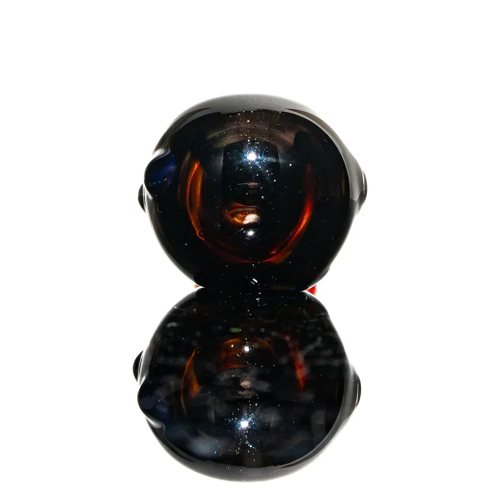 Amber and purple glass spoon pipe with glossy finish, shown against white background
