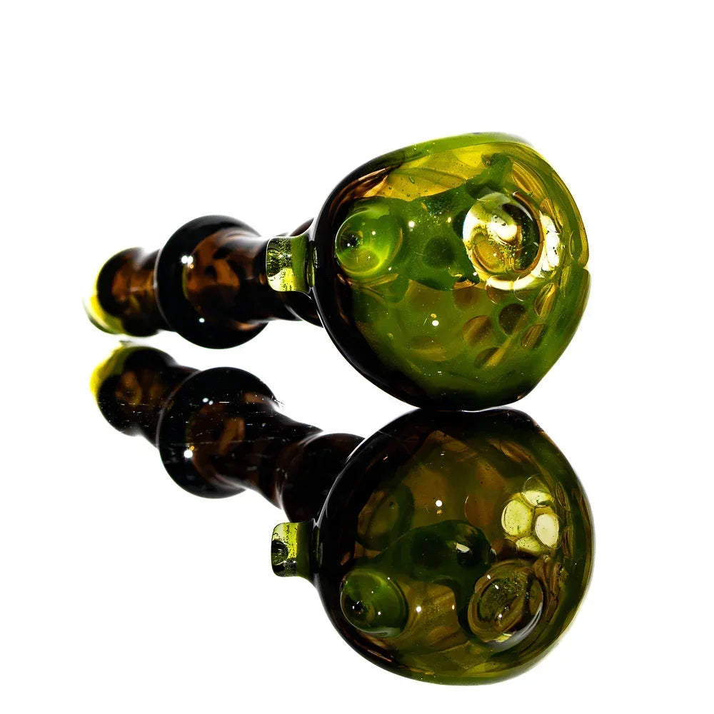 Black and green honeycomb glass hand pipe with reflective surface, artisan smoking accessory