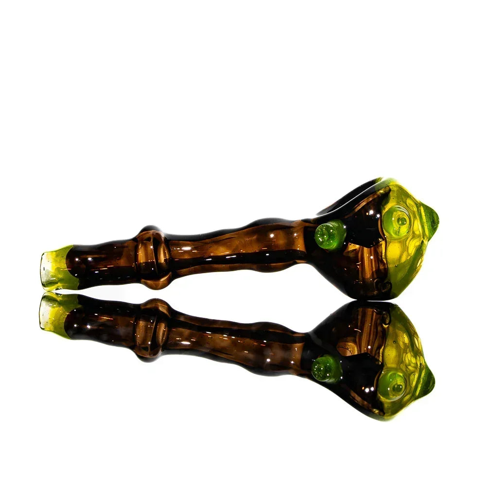 Black and yellow honeycomb pattern glass spoon hand pipe with reflective surface