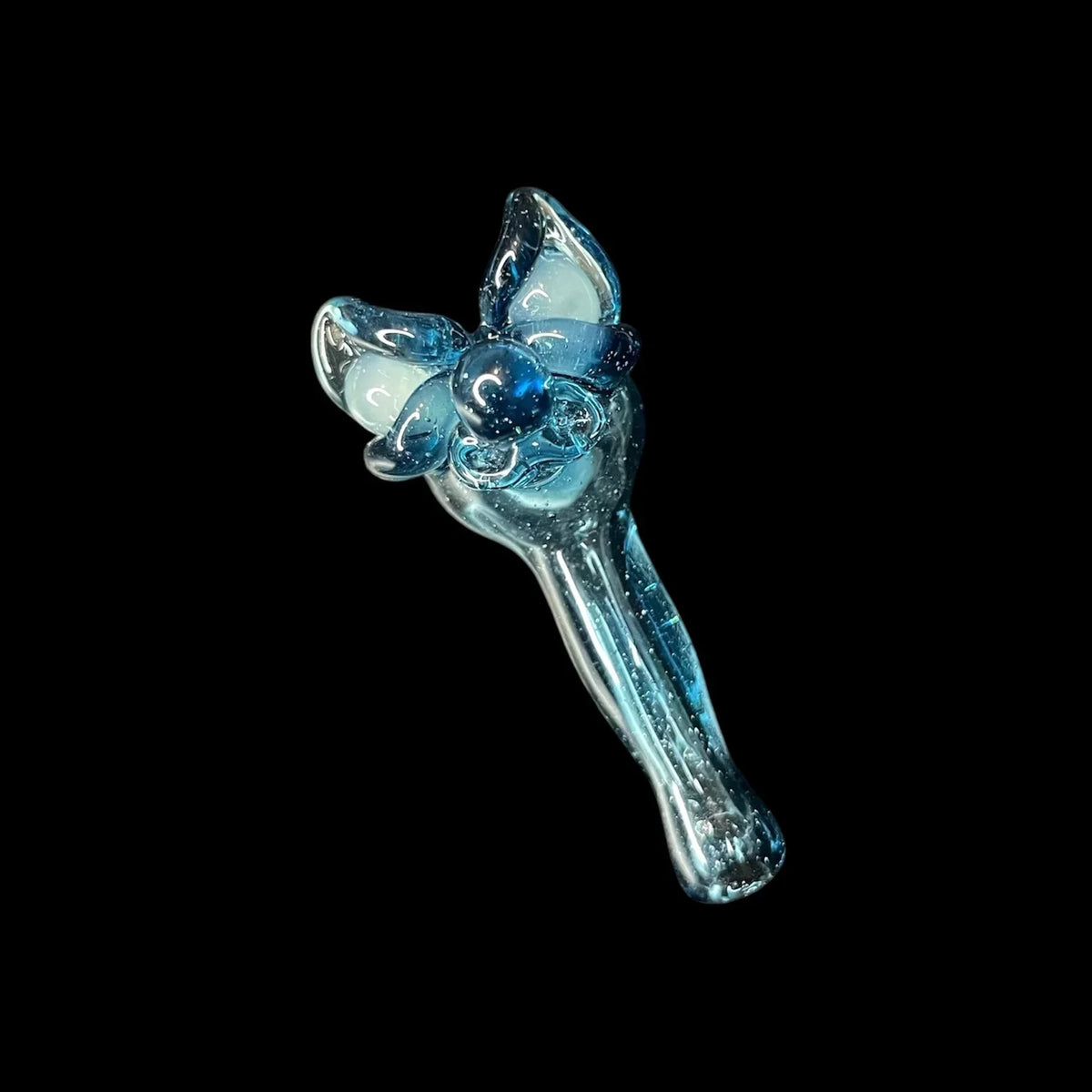 Blue glass joystick cap with artistic flower design on black background