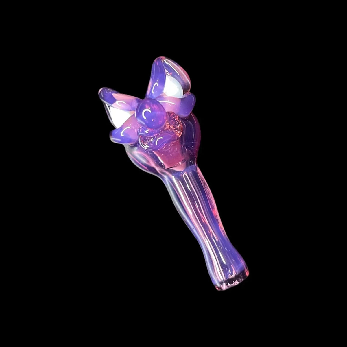 Iridescent purple glass hand pipe with sculpted flower-like design, isolated on black background.