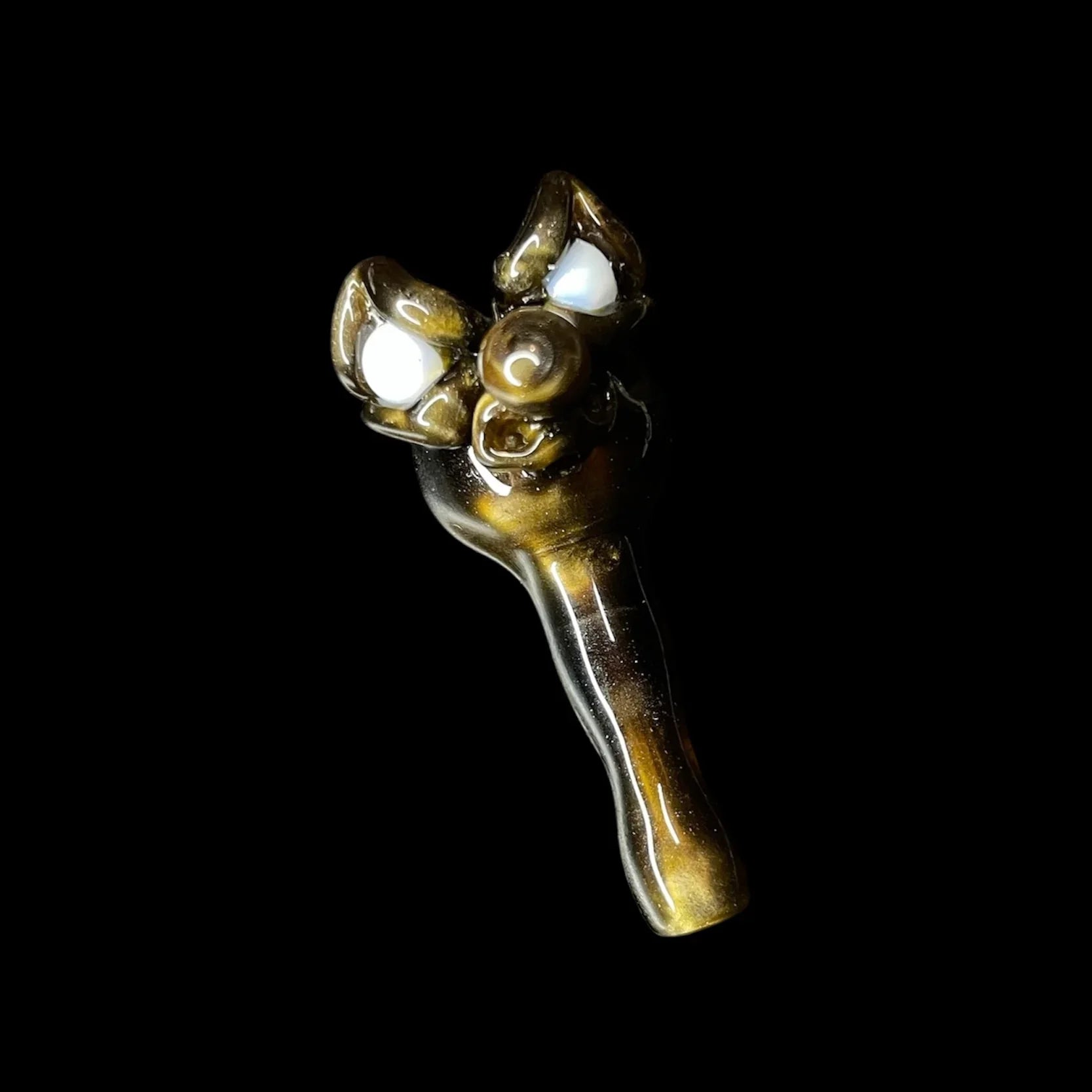 Handcrafted glass pipe with decorative opal accents on black background