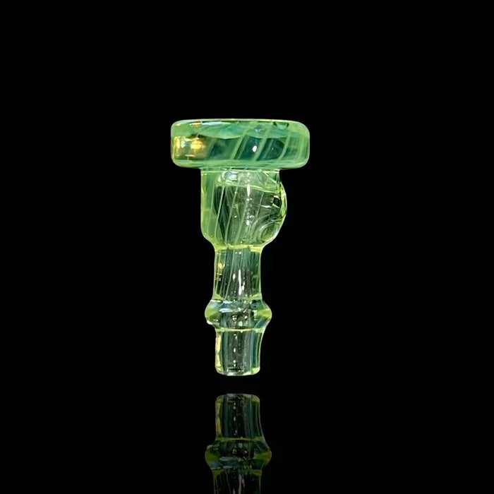 Green glass bowl piece with swirled design for water pipe on black background