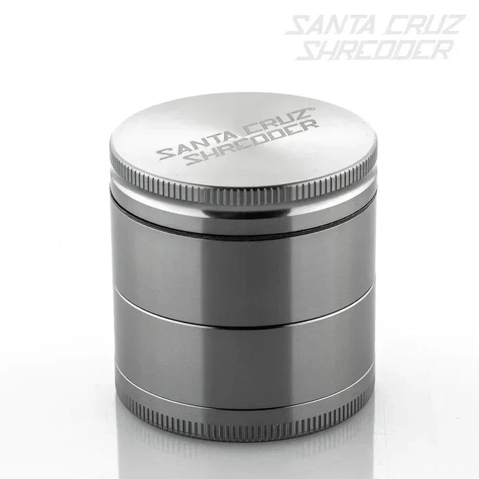 Stainless steel Santa Cruz Shredder herb grinder with engraved logo on lid, isolated on white.
