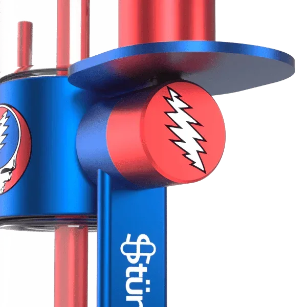 Close-up of a blue and red glass pipe with lightning bolt logo and skull design