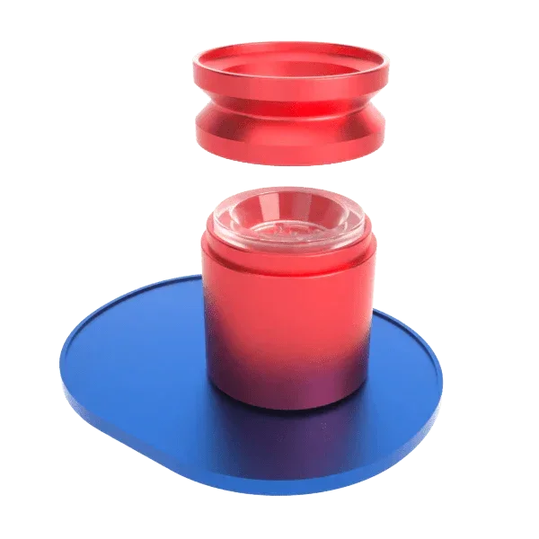 Red glass bowl assembly with liner, displayed on a blue surface, parts separated