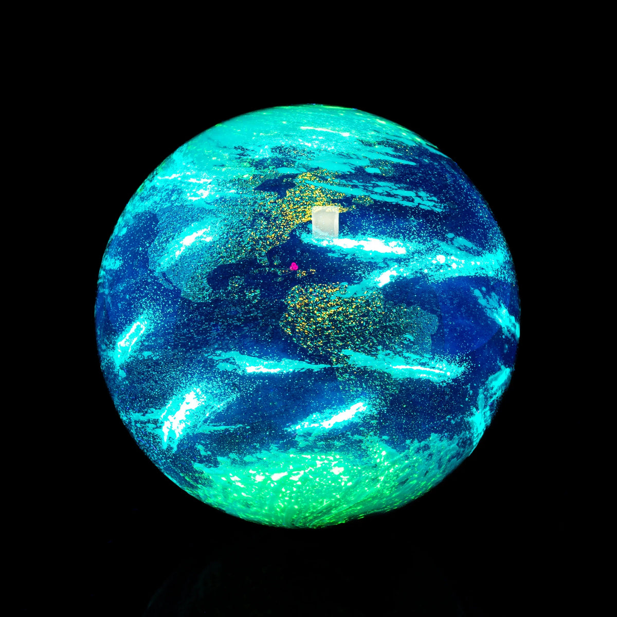 Handcrafted glass sphere with Earth design, shimmering blue and green on black background