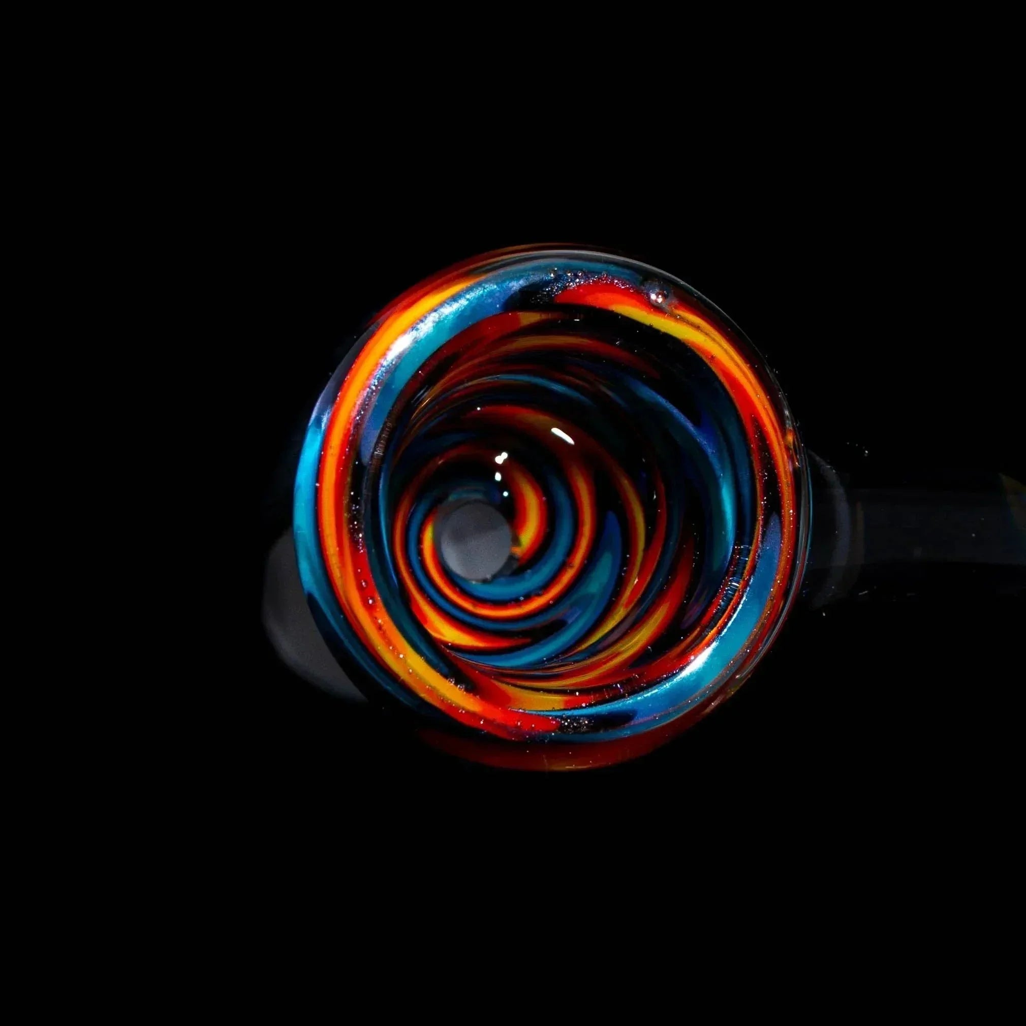 Colorful glass bowl slide with purple, blue, and orange wig wag pattern on black background