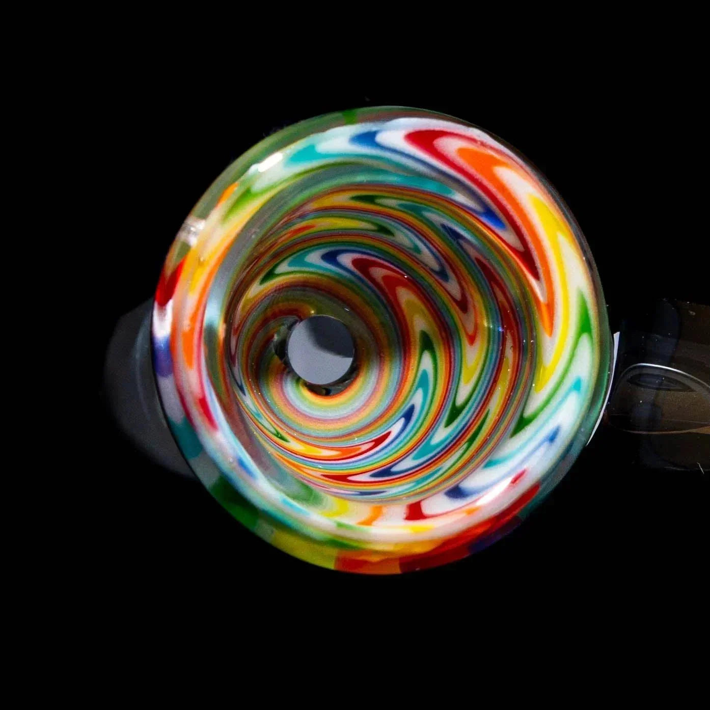 White and rainbow wig wag 14mm glass slide with colorful swirled pattern on black background