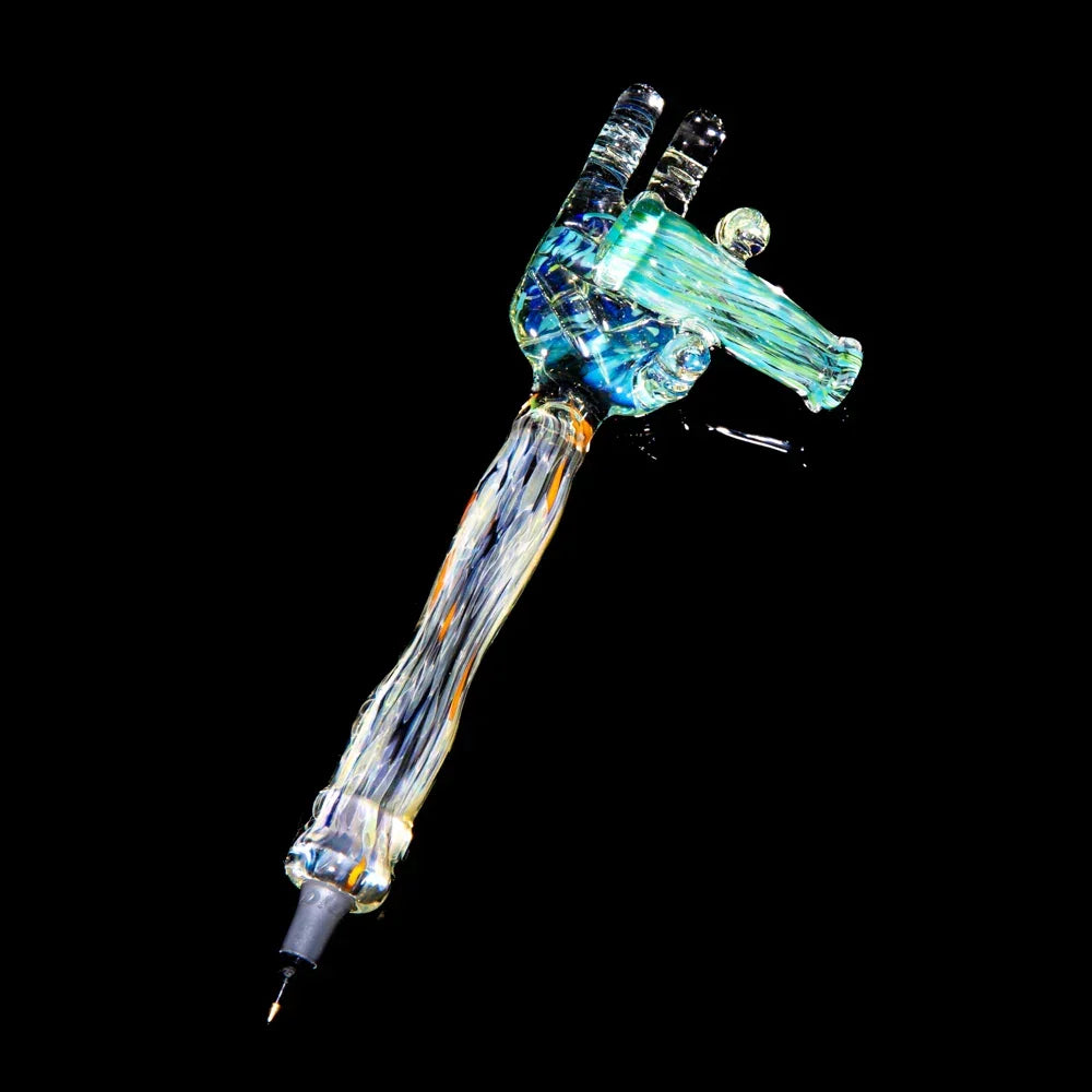 Colorful glass dab tool shaped like a hand with intricate details on a black background.