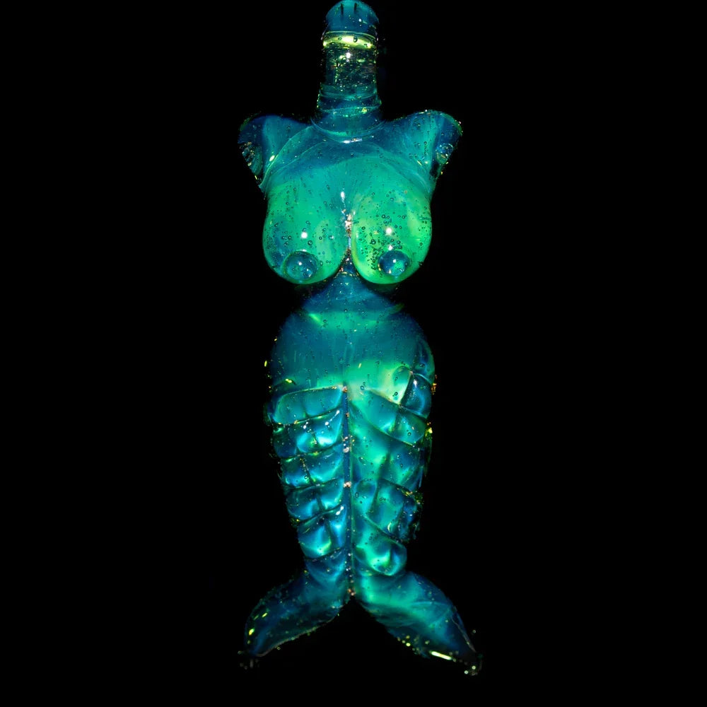 Handcrafted glass mermaid pendant with blue-green hues and iridescent accents on black background.
