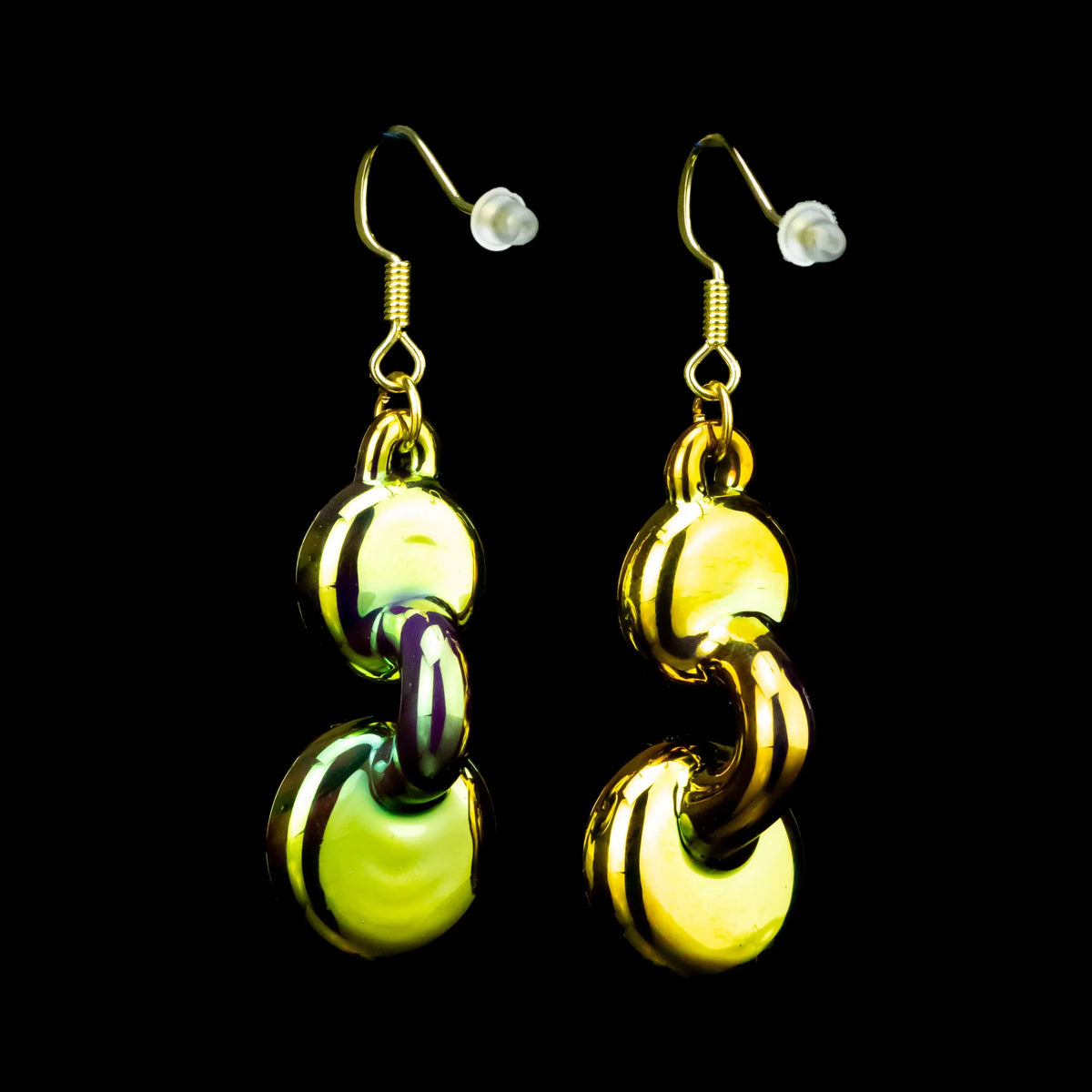 Handcrafted green and gold glass earrings with circular linked design on black background