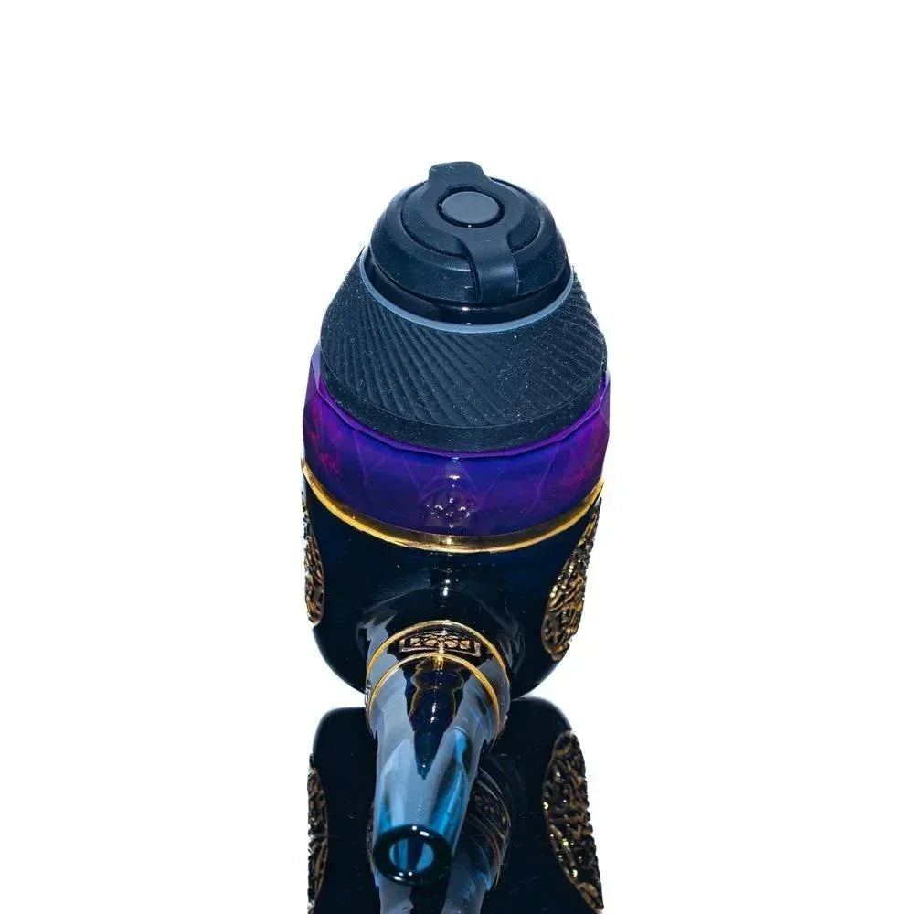 Colorful glass water pipe with intricate gold accents and blue mouthpiece, isolated on white