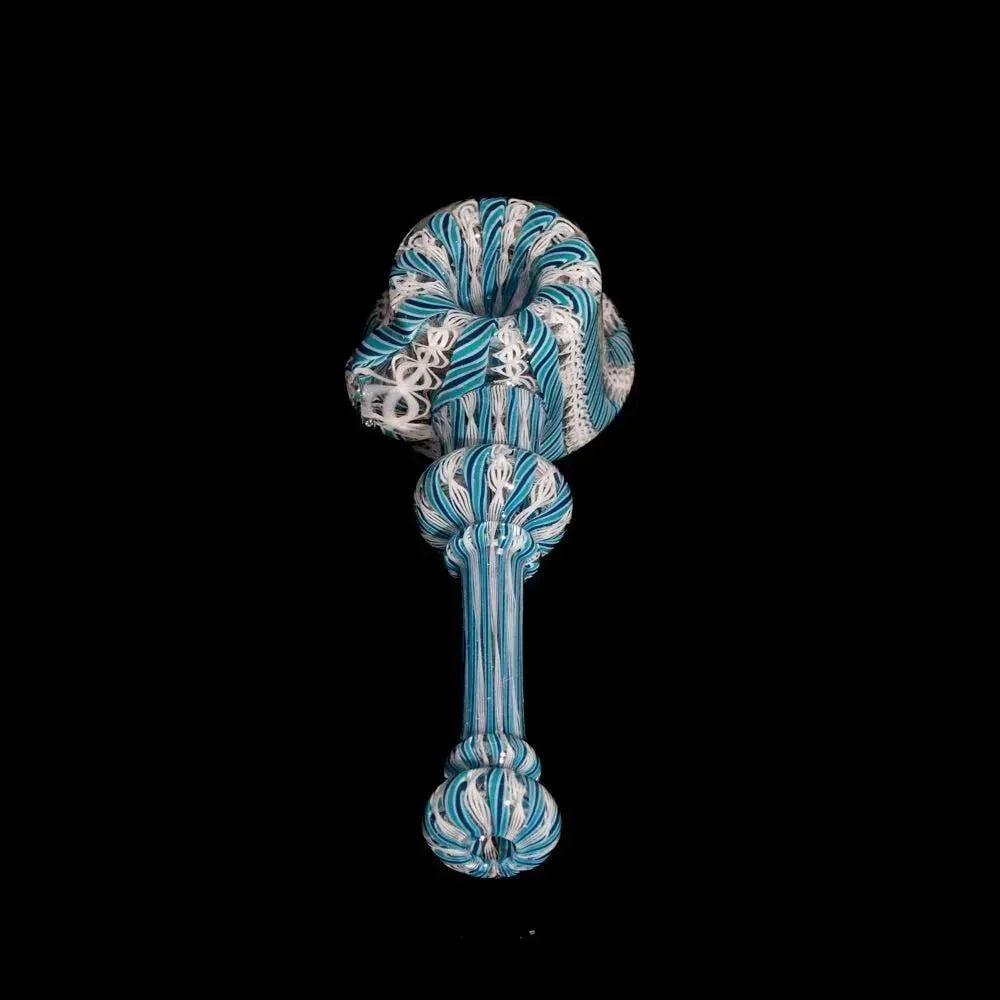 Handcrafted glass pipe with navy and teal zanfirico patterns on a black background