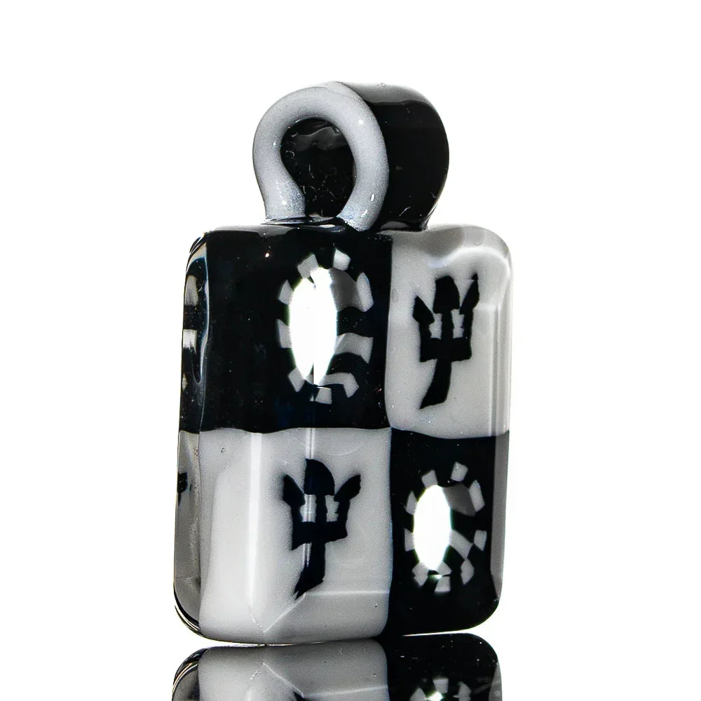 Black and white glass pendant with checkerboard and trident designs, heady glass accessory