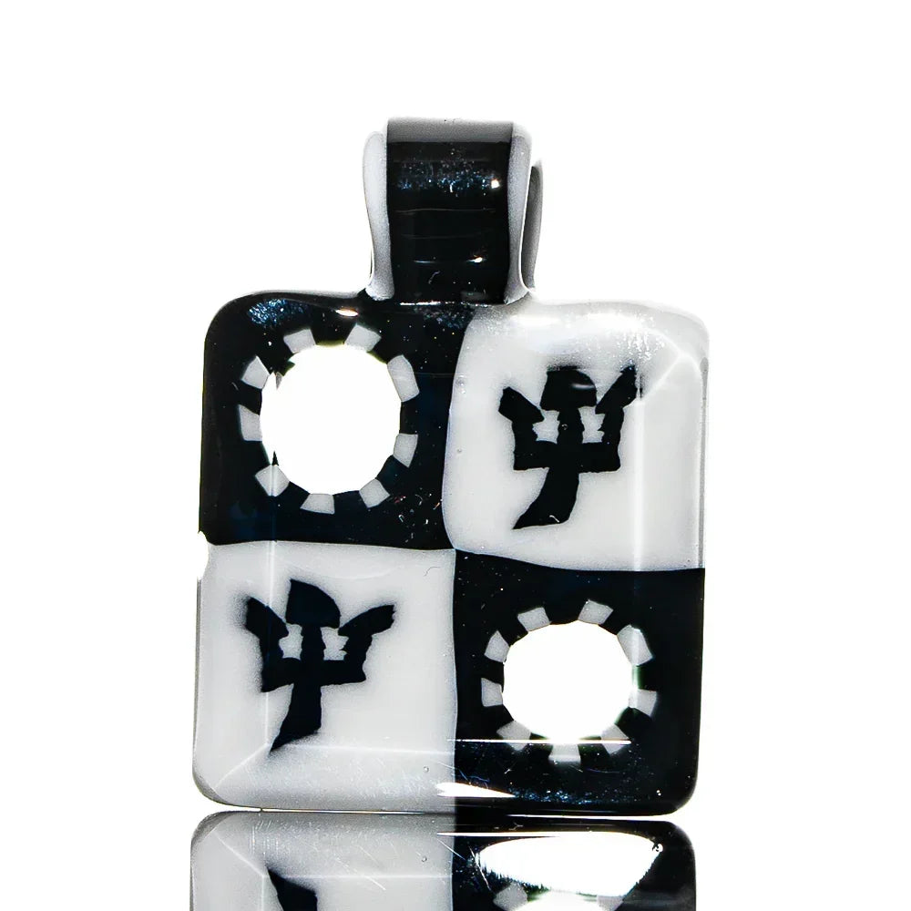 Black and white glass pendant with checker pattern, trident symbols, and circular cutouts