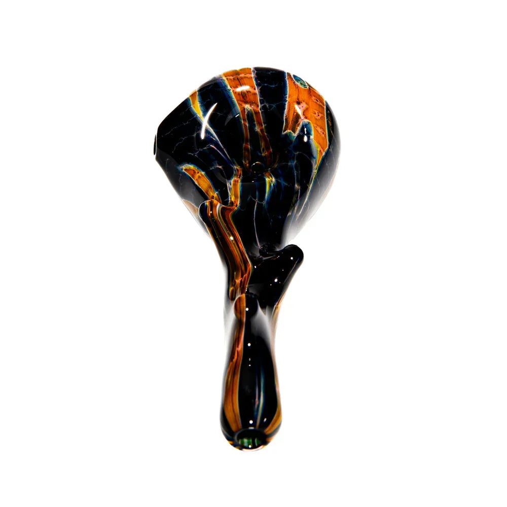 Hand-blown glass spoon pipe with burnt wood pattern and black, amber swirls on white background.