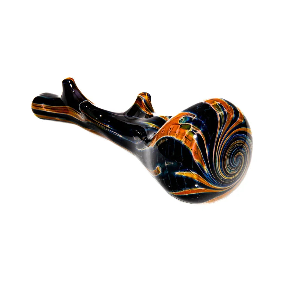 Colorful glass hand pipe shaped like a burnt branch with swirling orange and blue patterns