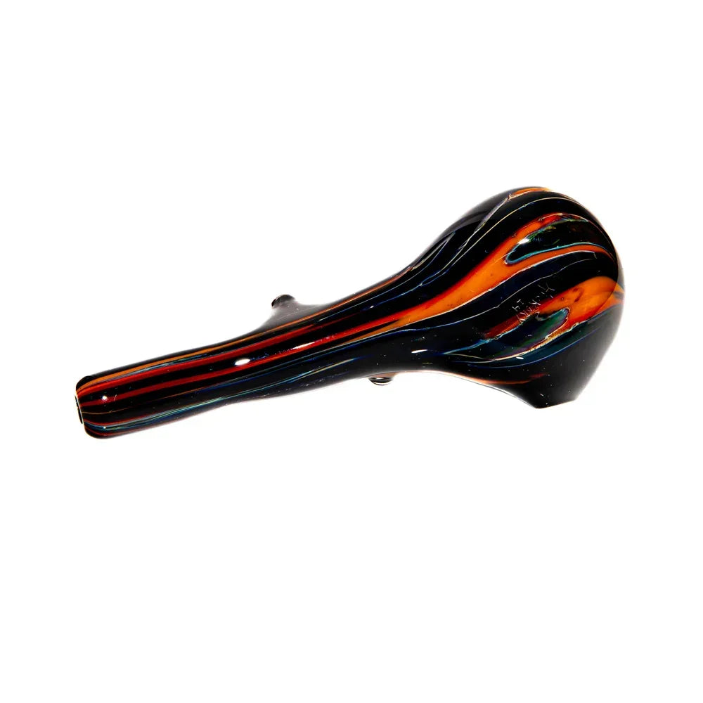 Hand-blown glass spoon pipe with black, orange, and teal striped design on white background.