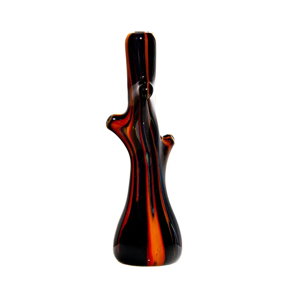Hand-blown glass pipe shaped like a tree branch with orange and black swirl design