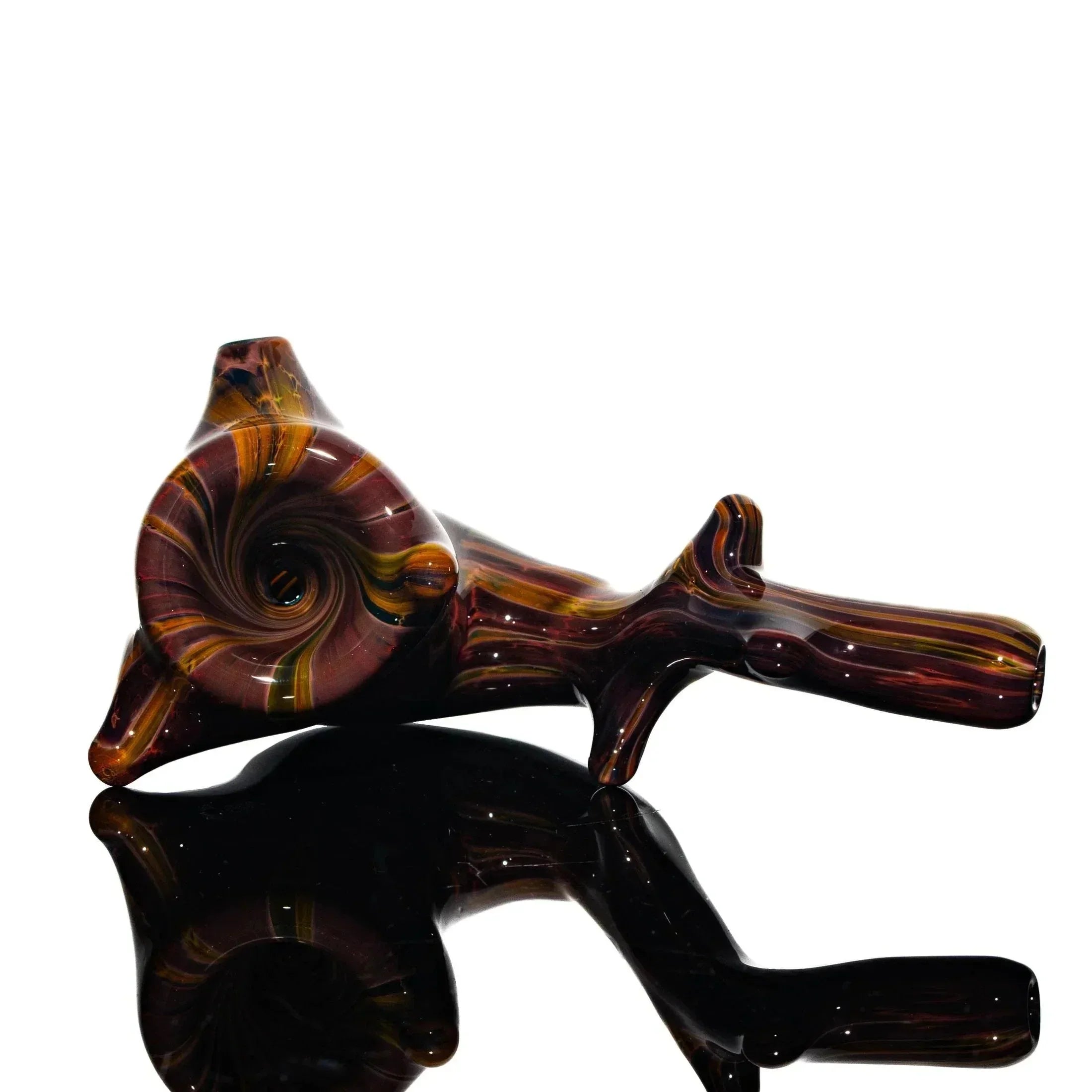 Handcrafted glass sherlock pipe with swirling brown, gold, and amber colors on black background.