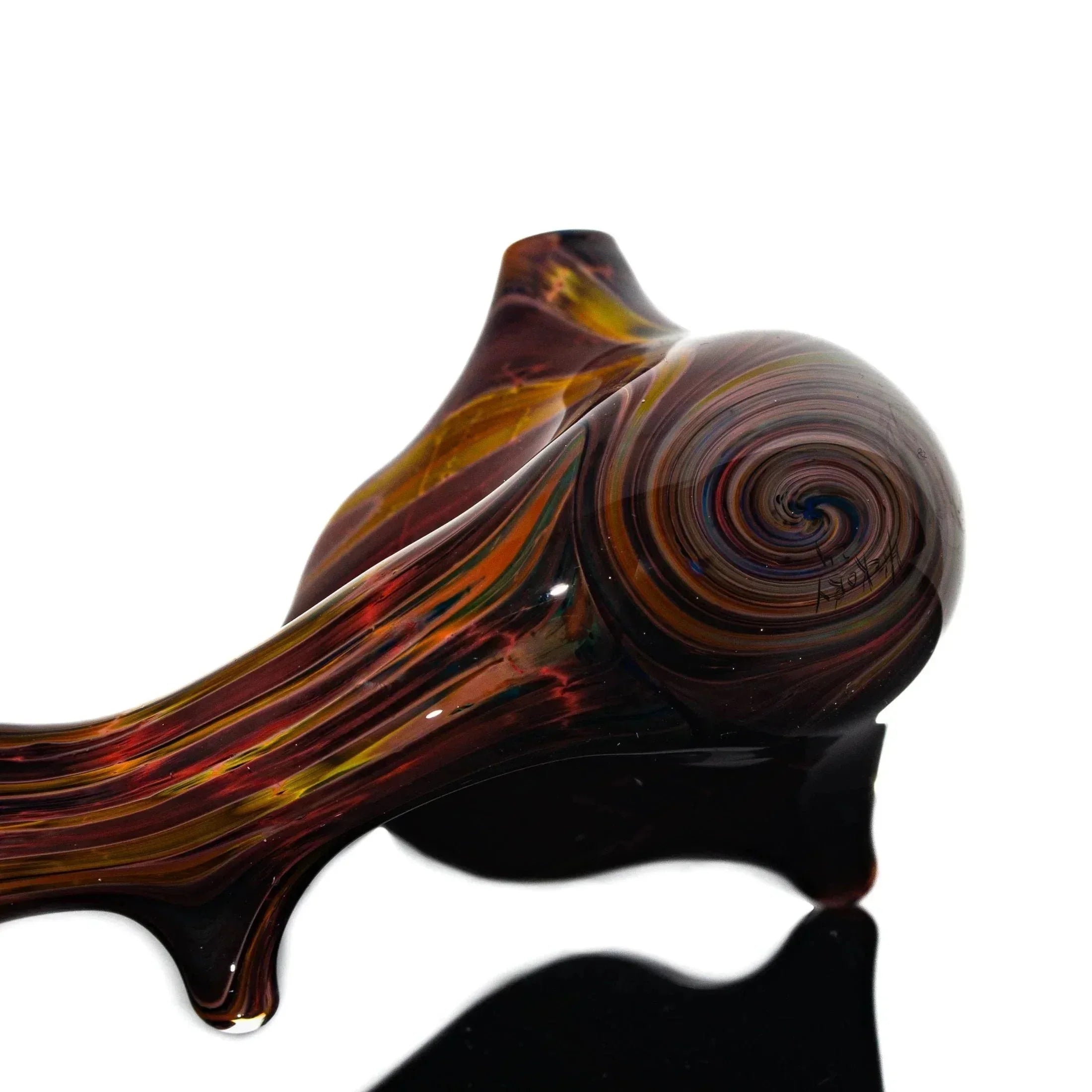 Handcrafted Sherlock glass pipe with hickory and cedar swirl design on reflective surface