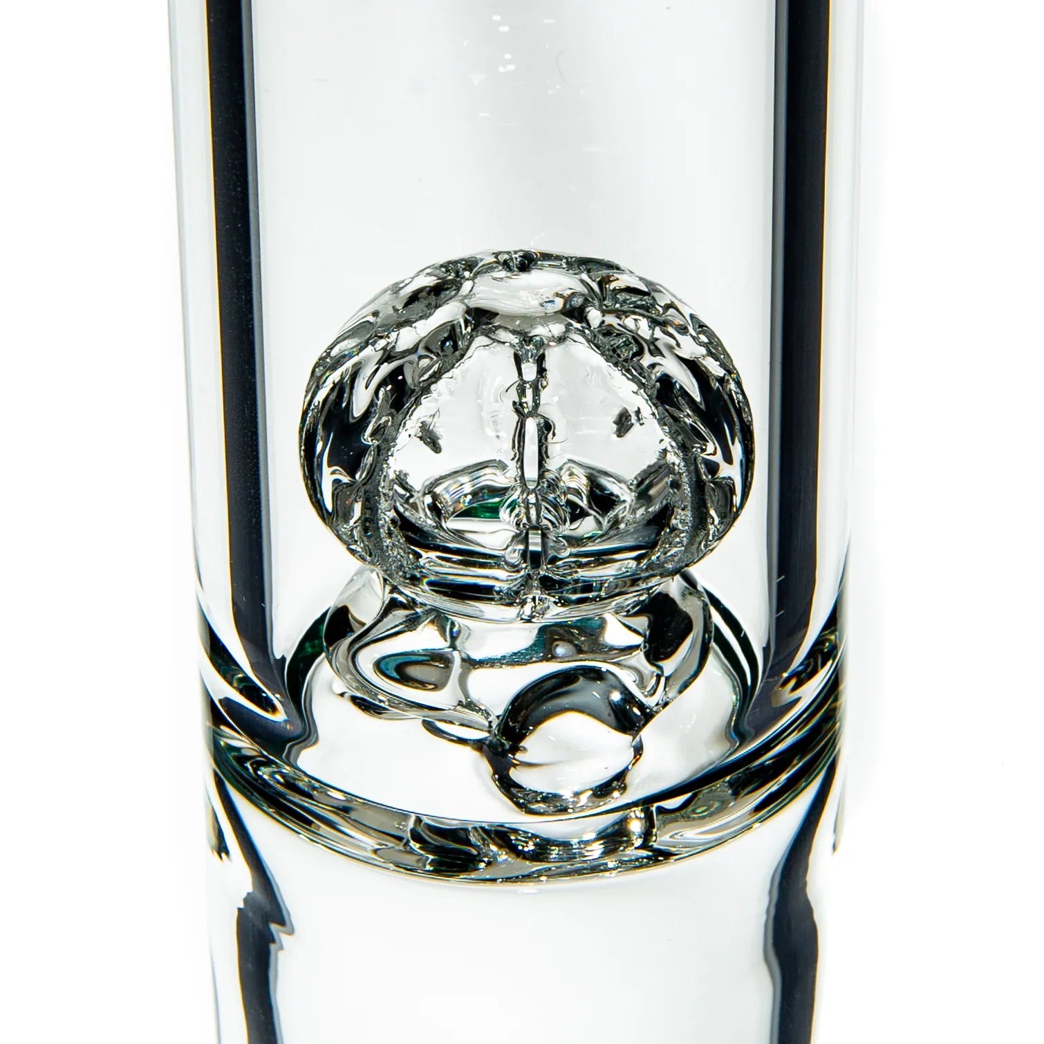 Close-up of intricate clear glass percolator in a premium water pipe