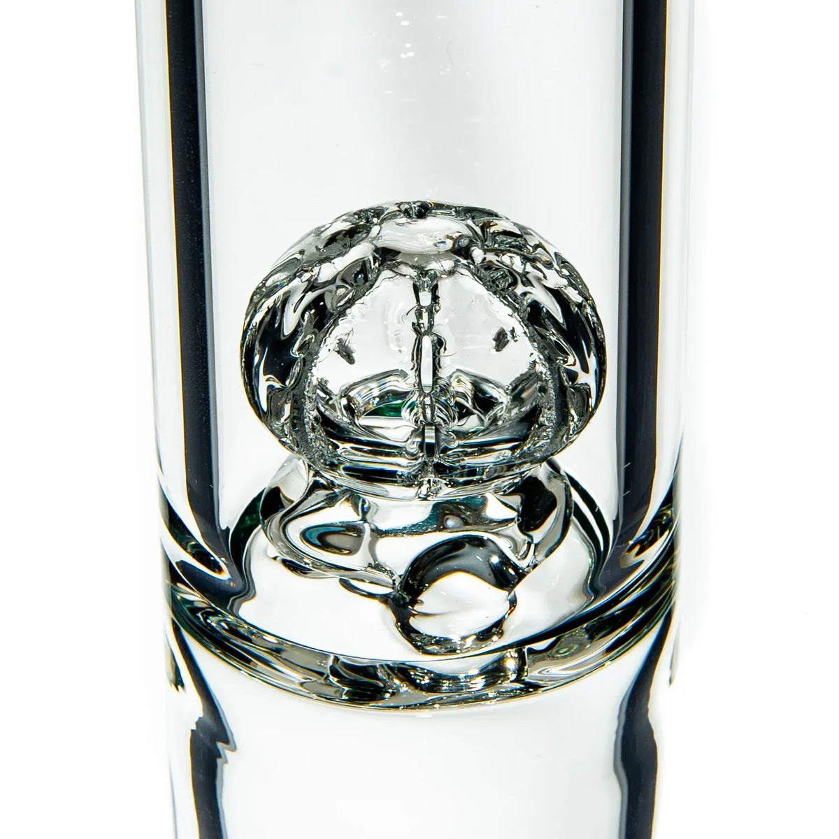 Close-up of intricate clear glass percolator in a premium water pipe