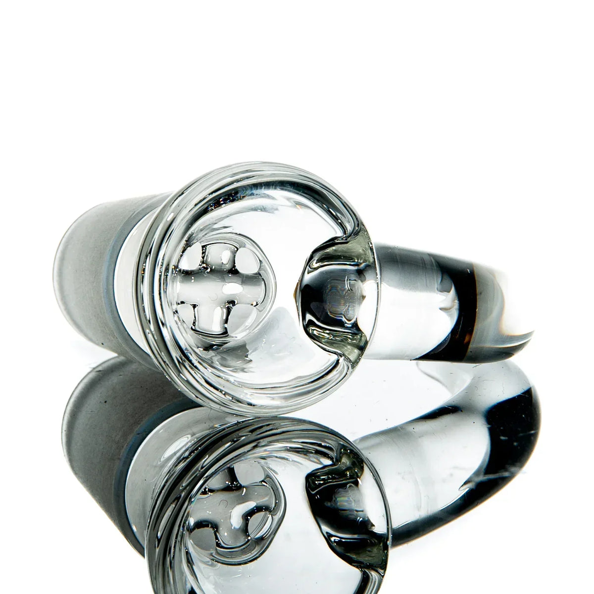 Clear glass bowl piece with grid-style screen for water pipe, reflected on white background
