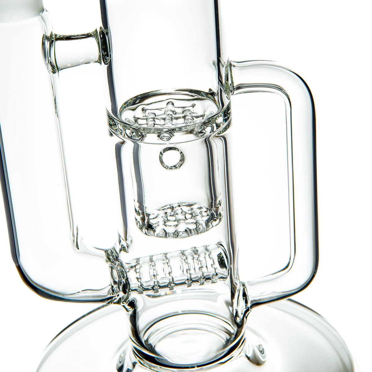 Clear glass water pipe with intricate percolator and handle, close-up view