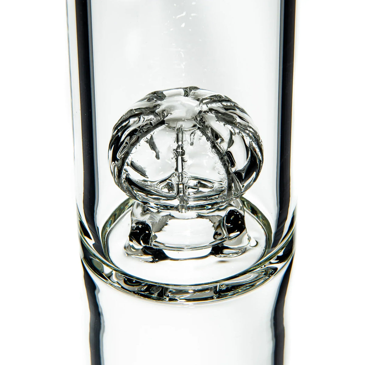 Clear glass percolator detail inside a thick glass water pipe for smoking accessories