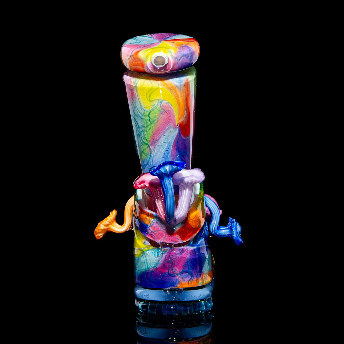 Colorful heady glass bong with mushroom accents on black background