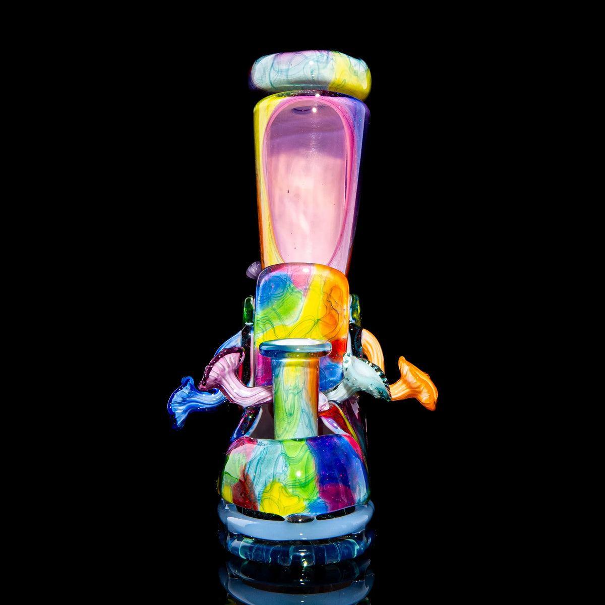 Colorful heady glass water pipe with artistic patterns and sculpted details on black background