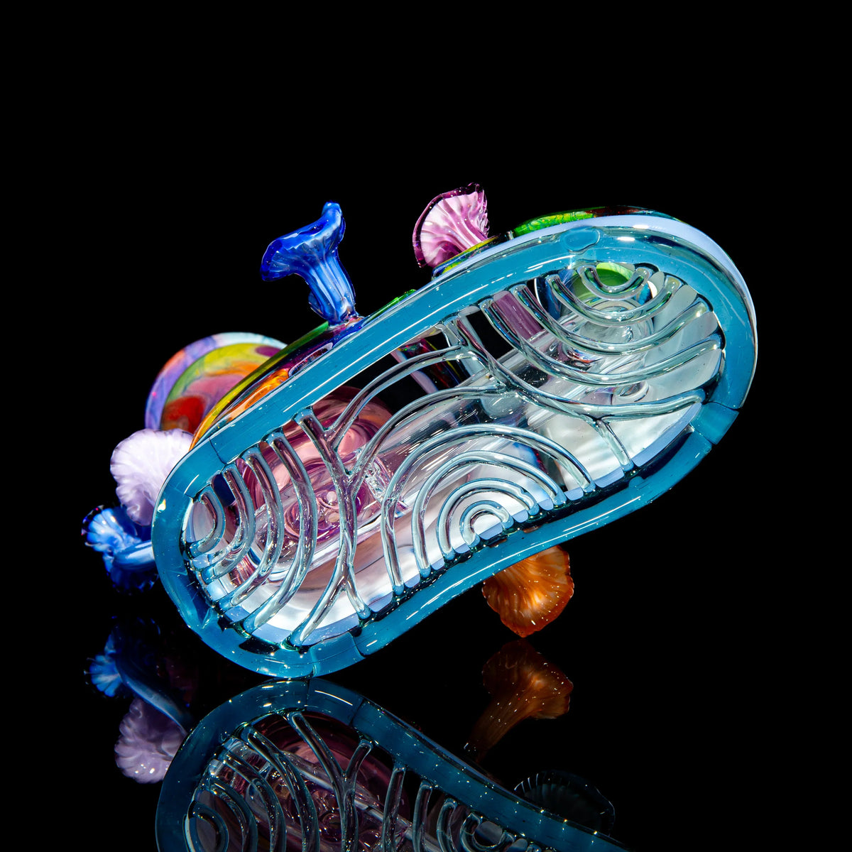 Colorful heady glass water pipe with intricate patterns and mushroom accents on black background