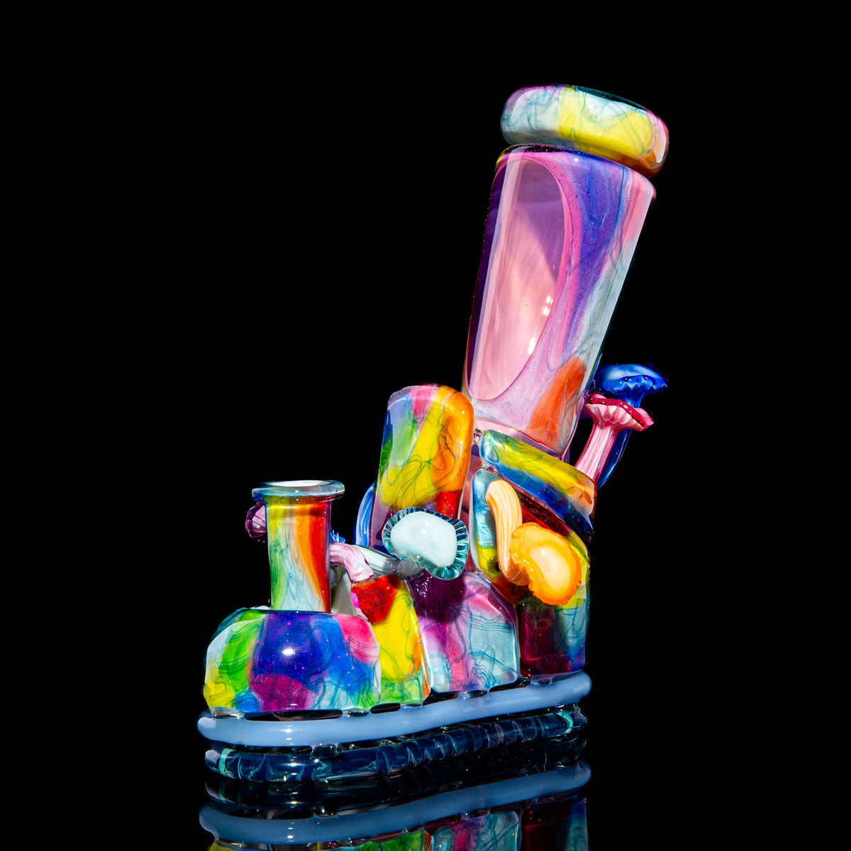 Colorful abstract glass art pipe with unique patterns, vibrant hues, and intricate sculpting