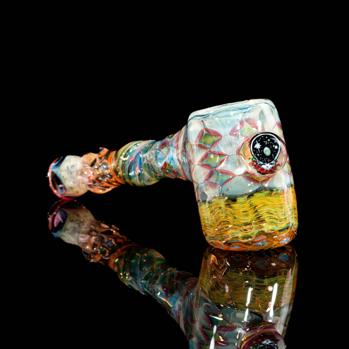 Intricate heady glass hammer pipe with colorful patterns and galaxy marble, on black background