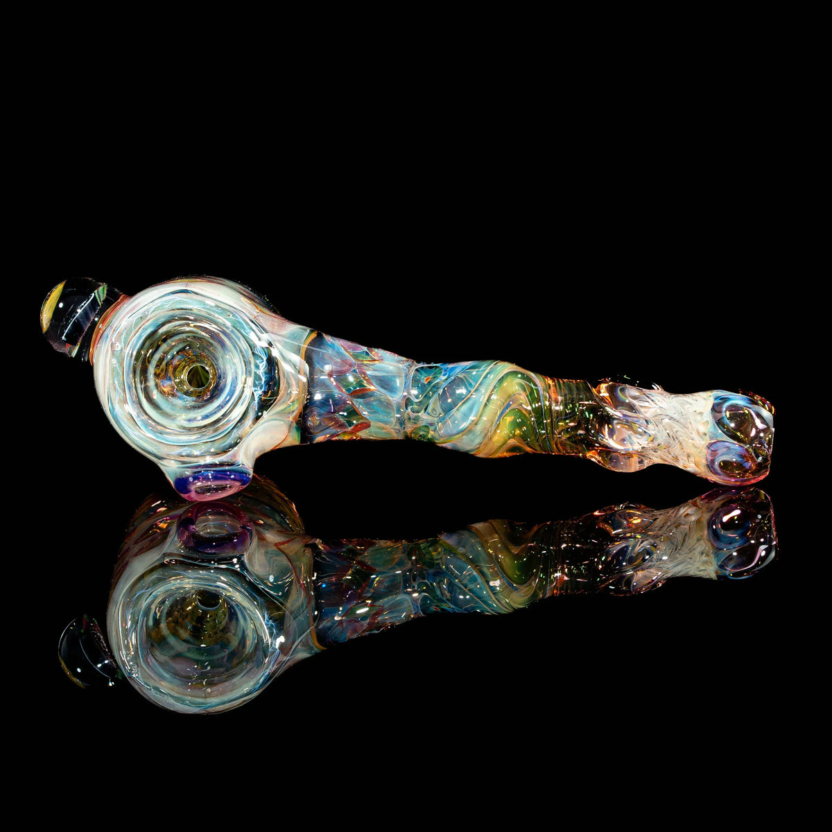 Heady glass hand pipe with colorful swirls and intricate patterns on a black background.